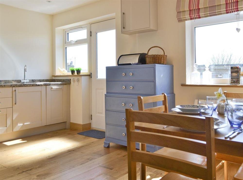 Spacious dining area in well-equipped kitchen at Bluebell Cottage in Burton in Lonsdale, near Ingleton, North Yorkshire