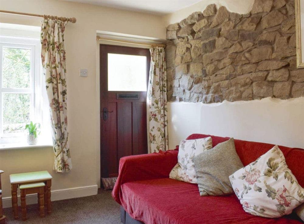Comfortable seating within the living room at Bluebell Cottage in Calder Vale, near Garstang, Lancashire