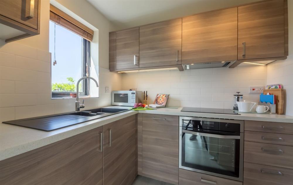 Ground floor: Well equipped, modern kitchen at Bluebell Cottage, Hindringham, Fakenham