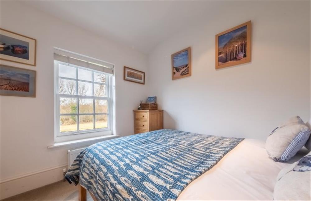 Bedroom three with a view of the garden and woodland at Bluebell Cottage, Little Walsingham
