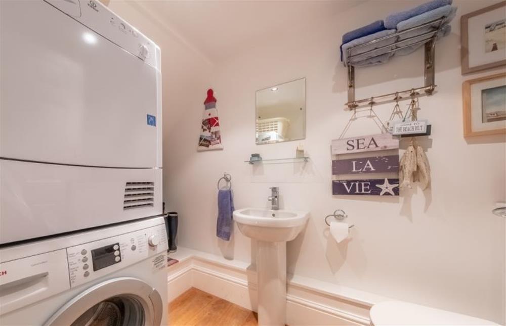 Utility/ WC with washing machine and tumble dryer at Bluebell Cottage, Little Walsingham