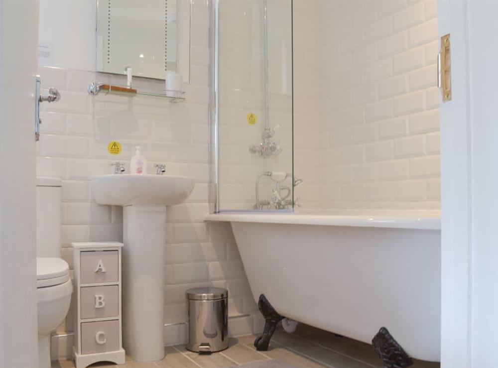 Stylish bathroom with roll top bath and shower over at Bluebell Cottage in Over Stowey, near Taunton, Somerset