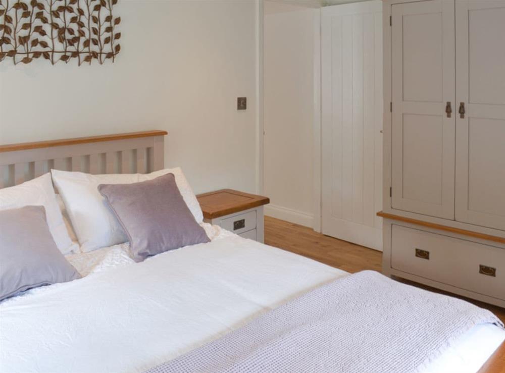 Warm and inviting double bedroom at Bluebell Cottage in Over Stowey, near Taunton, Somerset
