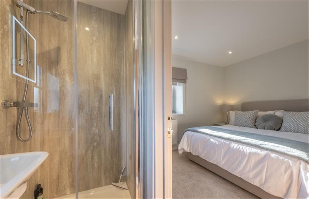 First floor: En-suite with shower, wash basin and WC