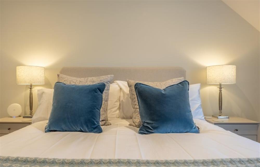 First floor: Master bedroom with a super-king size bed at Bluebell Cottage, Thornham near Hunstanton