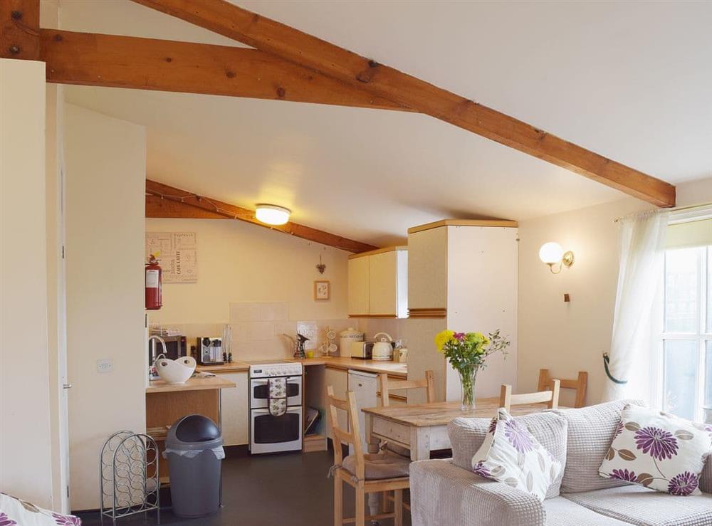 Exposed beams and a sloping ceiling make the living areas cosy and intimate at Blueberry Cottage in Debenham, near Framlingham, Suffolk
