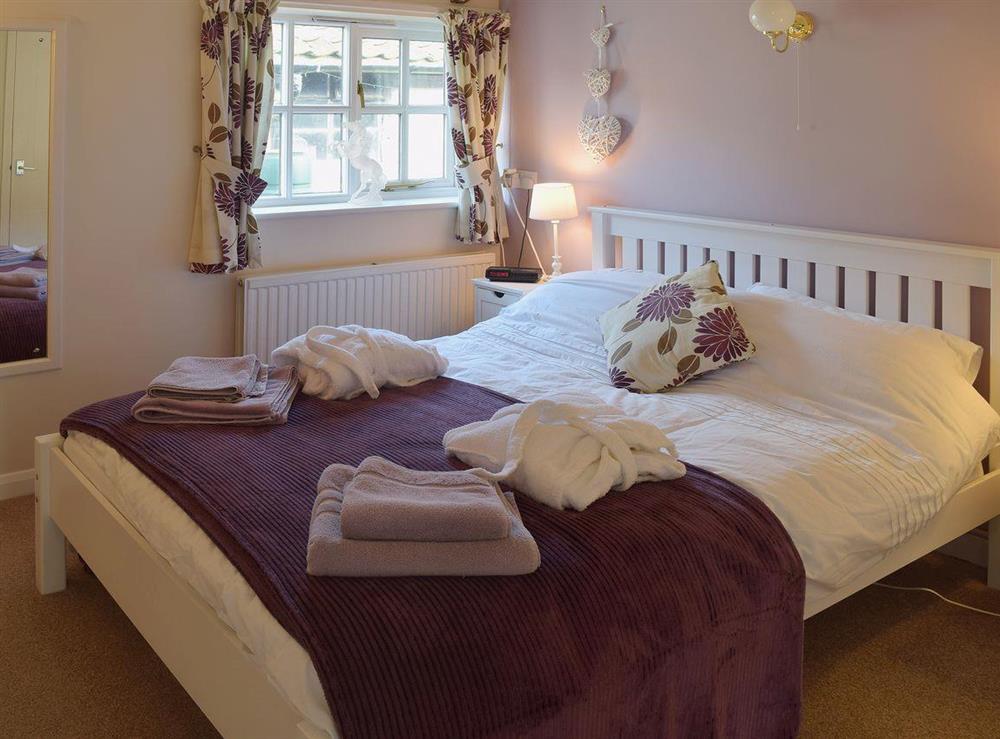 The double bedroom boasts a comfortable 5ft king size bed at Blueberry Cottage in Debenham, near Framlingham, Suffolk