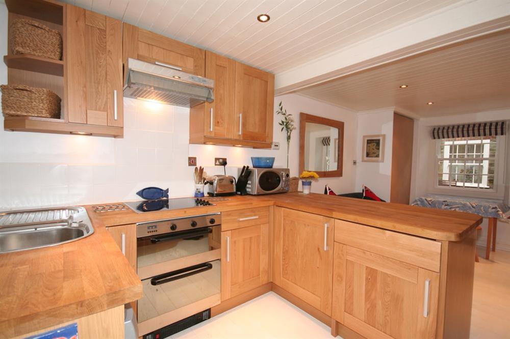 Modern well equipped kitchen at Blueboat Cottage in 23 Island Street, Salcombe