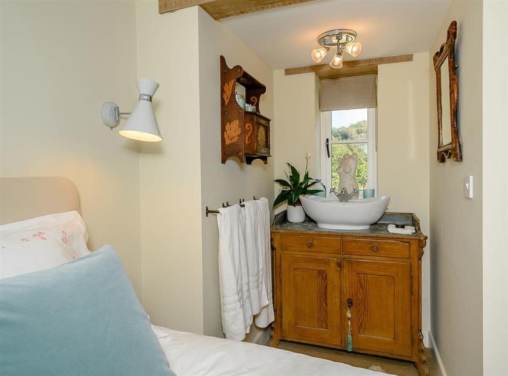 Twin bedroom with sink at Blurridge Barn in Combe Martin, near Ilfracombe, Devon