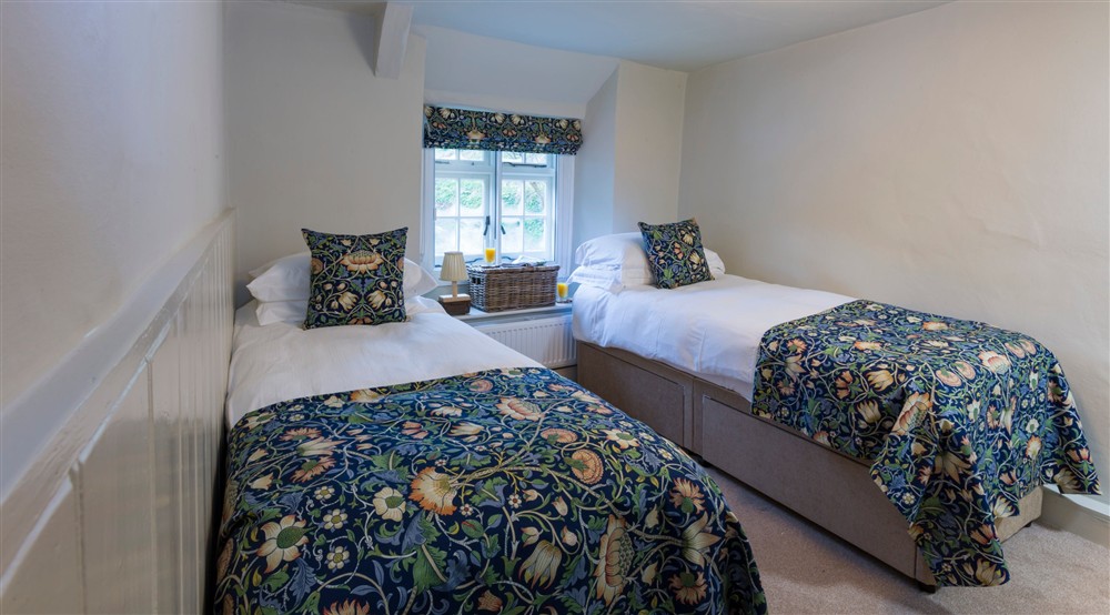 The twin bedroom at Boar Mill Cottage in Corfe Castle, Dorset