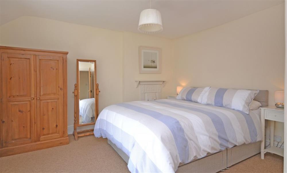 The master bedroom with views of the estuary. at Boathouse Cottage in Frogmore