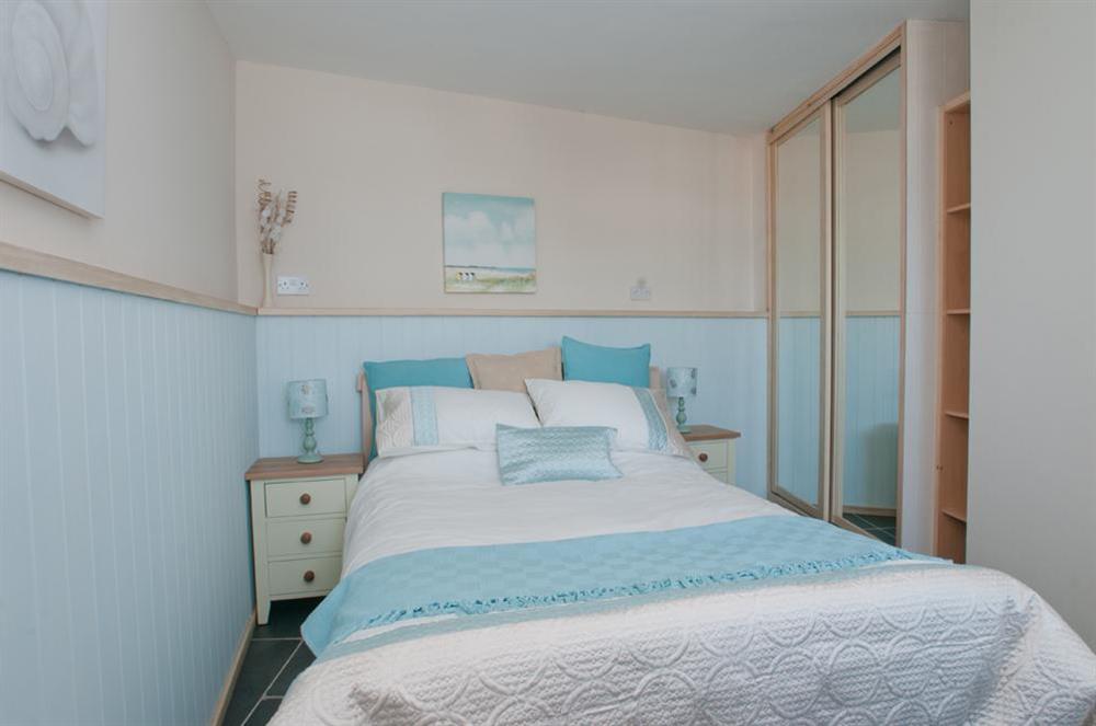 Master bedroom with sea views at Boathouse Cottage in Torcross, Kingsbridge