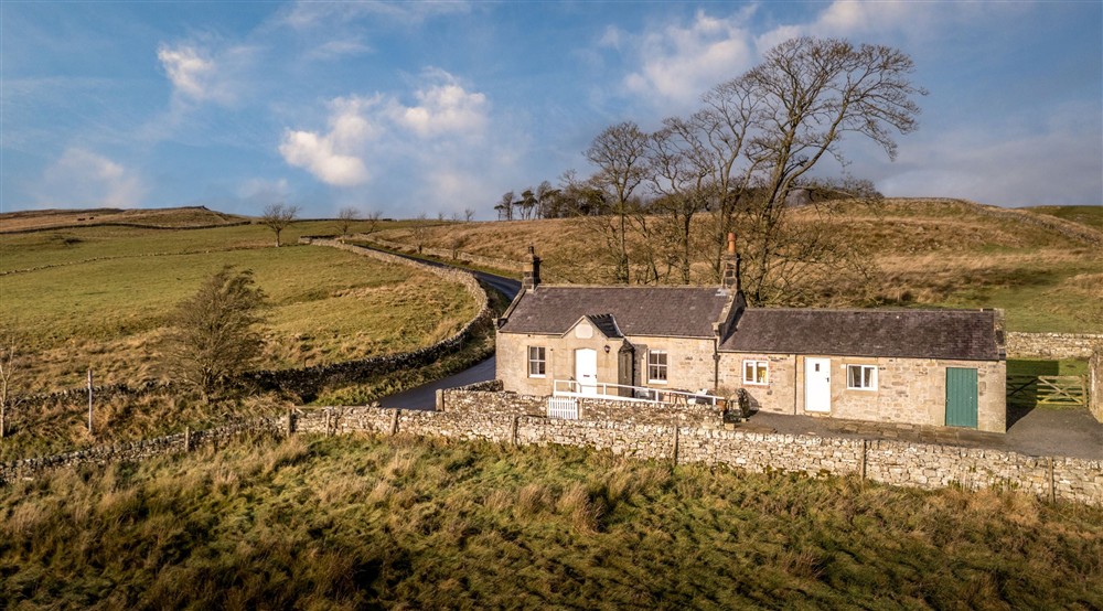 Peel Cottage, a single storey holiday cottage, part-way up a hill at Boatman's Loft in Whitby, North Yorkshire