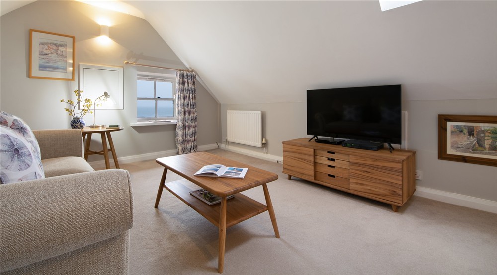 The open-plan kitchen, sitting and dining room at Boatman's Loft in Whitby, North Yorkshire