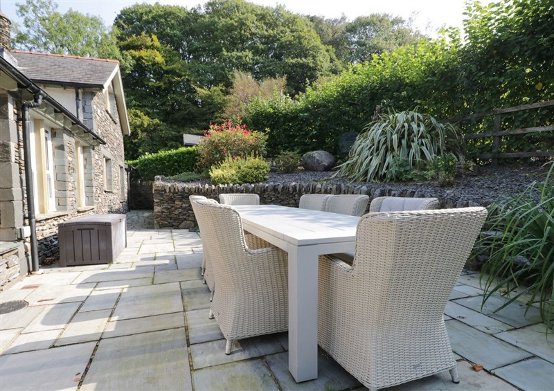 Enjoy a cup of tea on the patio at Bobbin Mill Cottage, Lakeside near Newby Bridge