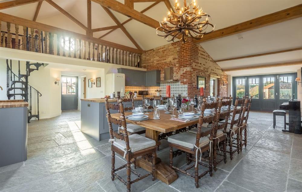 Spacious open plan dining room seating up to twelve guests and with underfloor heating throughout at Bodney Lodge, Bodney