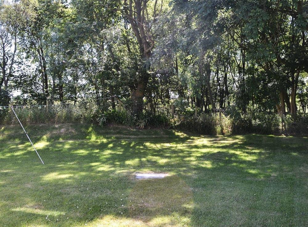 Mainly lawned garden at Bodwi Isaf in near Abersoch, Gwynedd