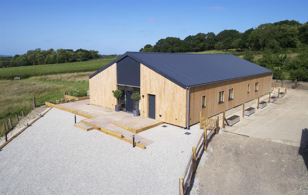 Bokes Barn is a contemporary barn conversion overlooking 80 acres of vineyards, in an Area of Outstanding Natural Beauty