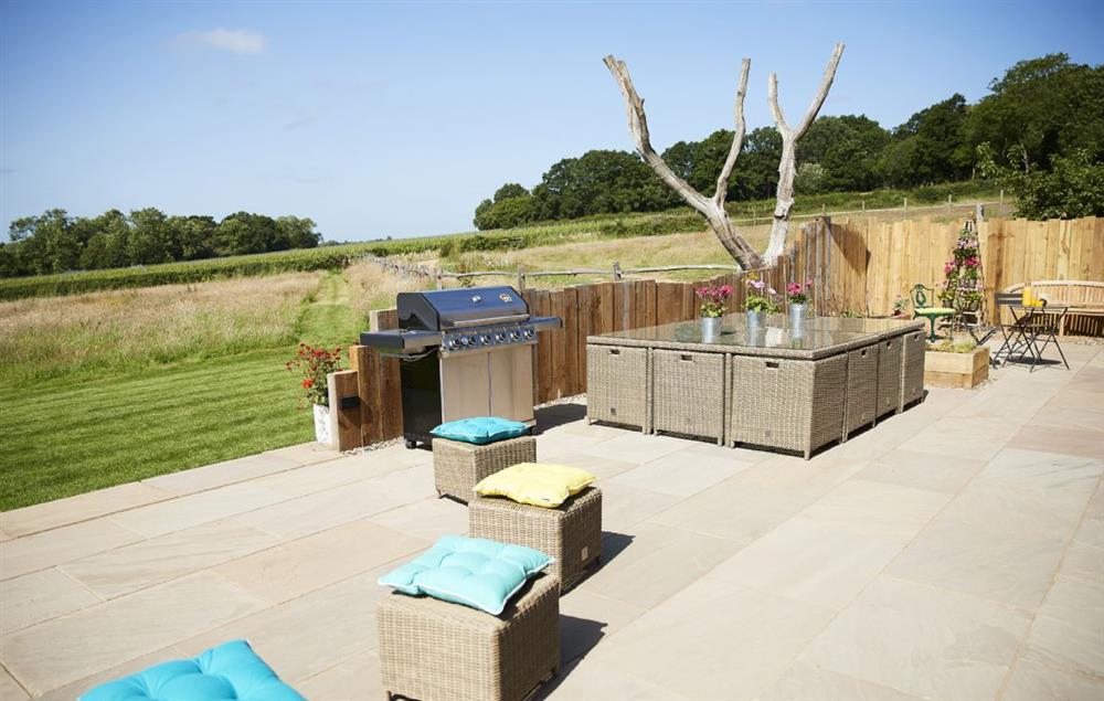 Large, south-facing terrace, with its commanding views over the fields beyond at Bokes Barn, Hawkhurst