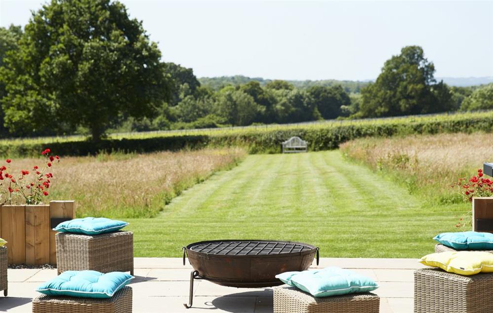 The sun terrace affords stunning views across open countryside at Bokes Barn, Hawkhurst
