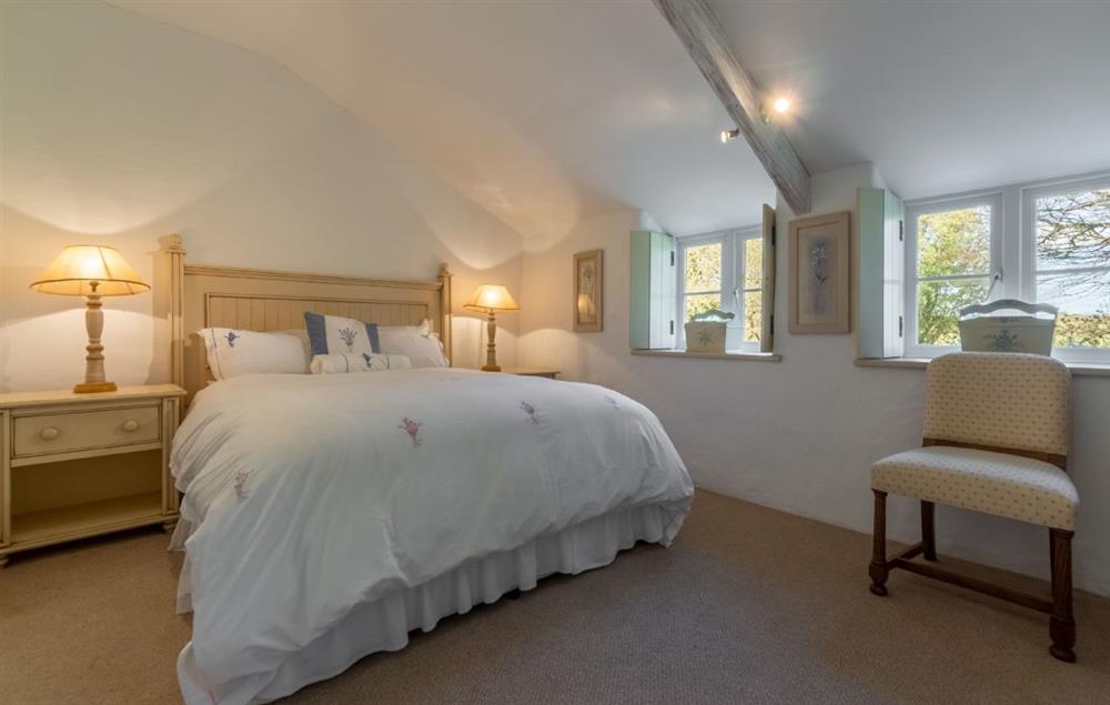 Double bedroom with 5’ king-size bed and en-suite wet room at Bonython Farmhouse, Helston