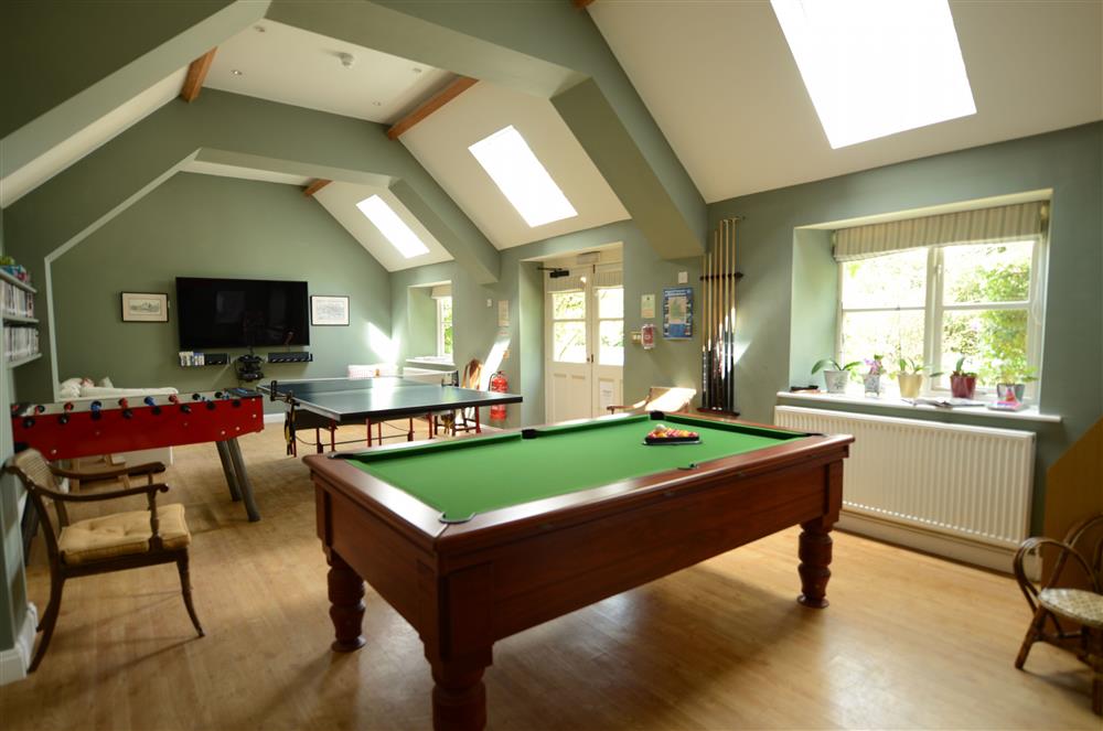 The large communal games room, with something for everyone at Bookers Cottage, Bruern, near Chipping Norton