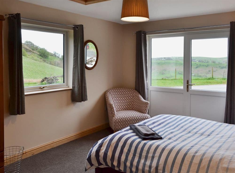 Light and airy double bedroom with fabulous views of the surrounding area (photo 2) at Booth Farm Cottage, 