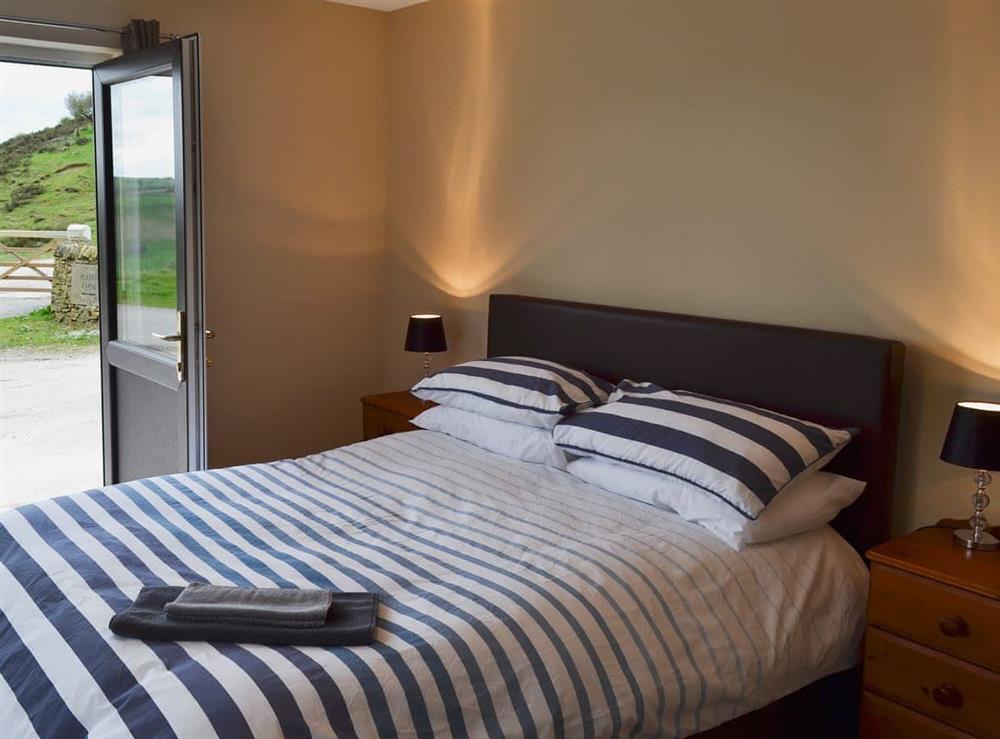 Light and airy double bedroom with fabulous views of the surrounding area at Booth Farm Cottage, 