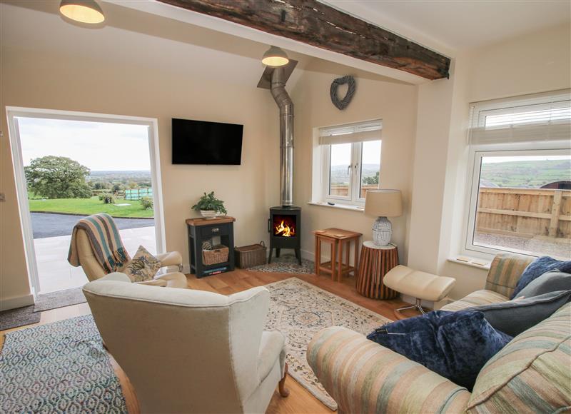 Relax in the living area at Border View Lodge, Llandrinio