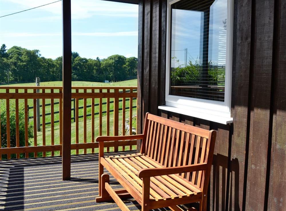 Relaxing veranda with fanastic views at Boreland Farm Cabin, 