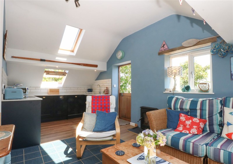 Relax in the living area (photo 2) at Borth Arian Boat House, Rhoscolyn