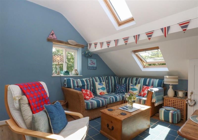 Relax in the living area at Borth Arian Boat House, Rhoscolyn