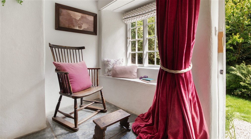 The reading nook in the dining hall at Boscastle Elm Cottage in Boscastle, Cornwall