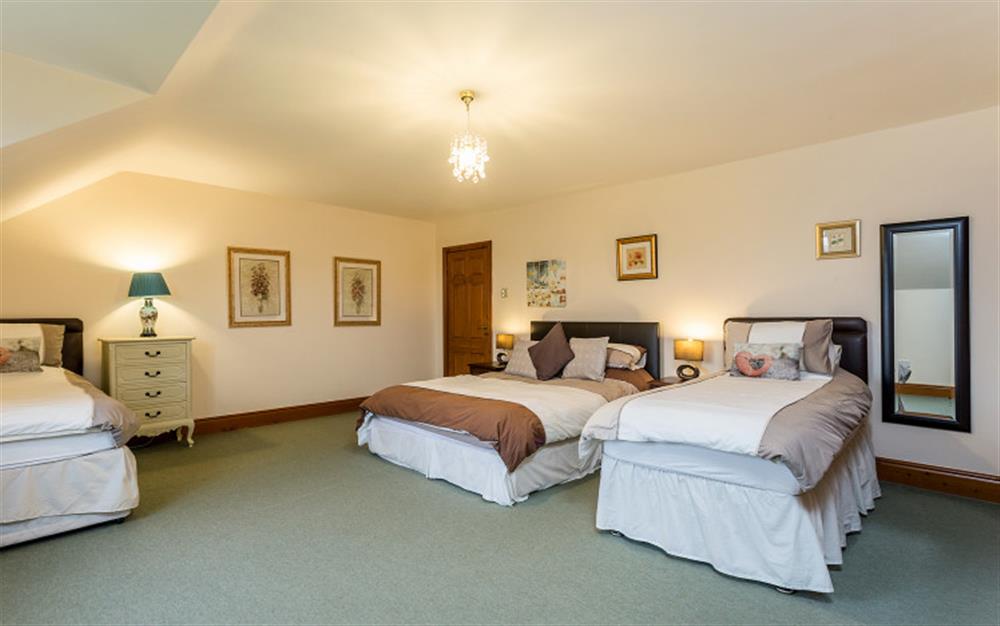 Bedroom 5 a double and two singles at Boshill House in Lyme Regis