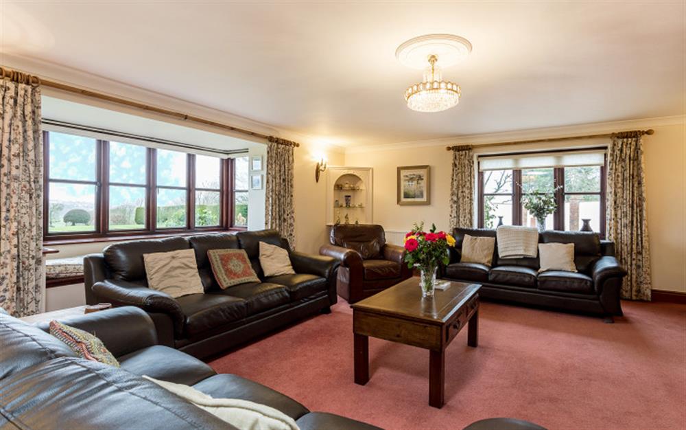 Large spacious lounge with ample seating at Boshill House in Lyme Regis