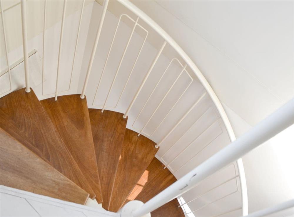 Open-tread spiral stairs to first floor at Bosun’s Locker in Lymington, Hants., Hampshire
