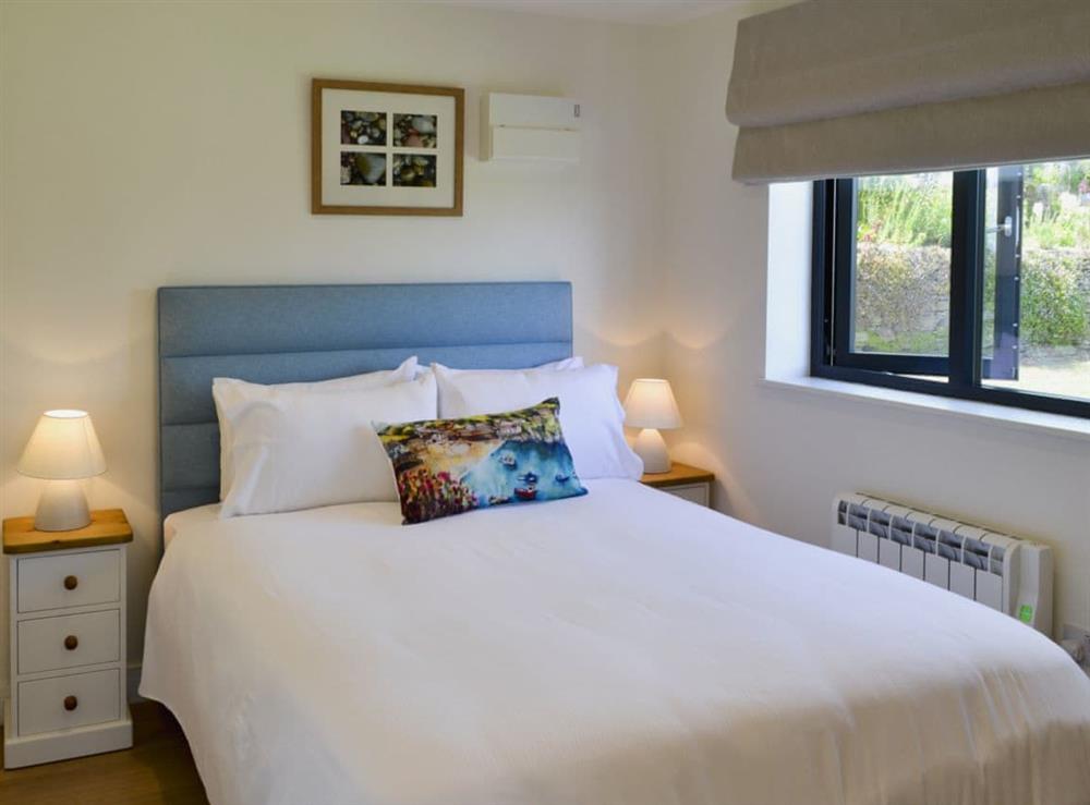 Comfy bedroom with kingsize bed at Bosuns in Port Isaac, near Wadebridge, Cornwall