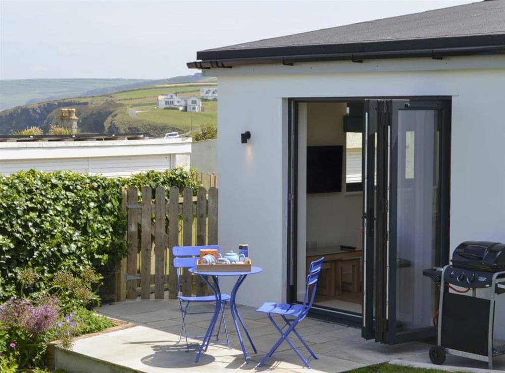 Sitting-out area with garden furniture, BBQ and lovely sea views (photo 2) at Bosuns in Port Isaac, near Wadebridge, Cornwall