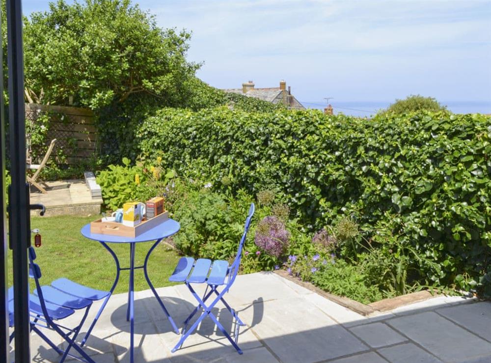 Sitting-out area with garden furniture, BBQ and lovely sea views at Bosuns in Port Isaac, near Wadebridge, Cornwall