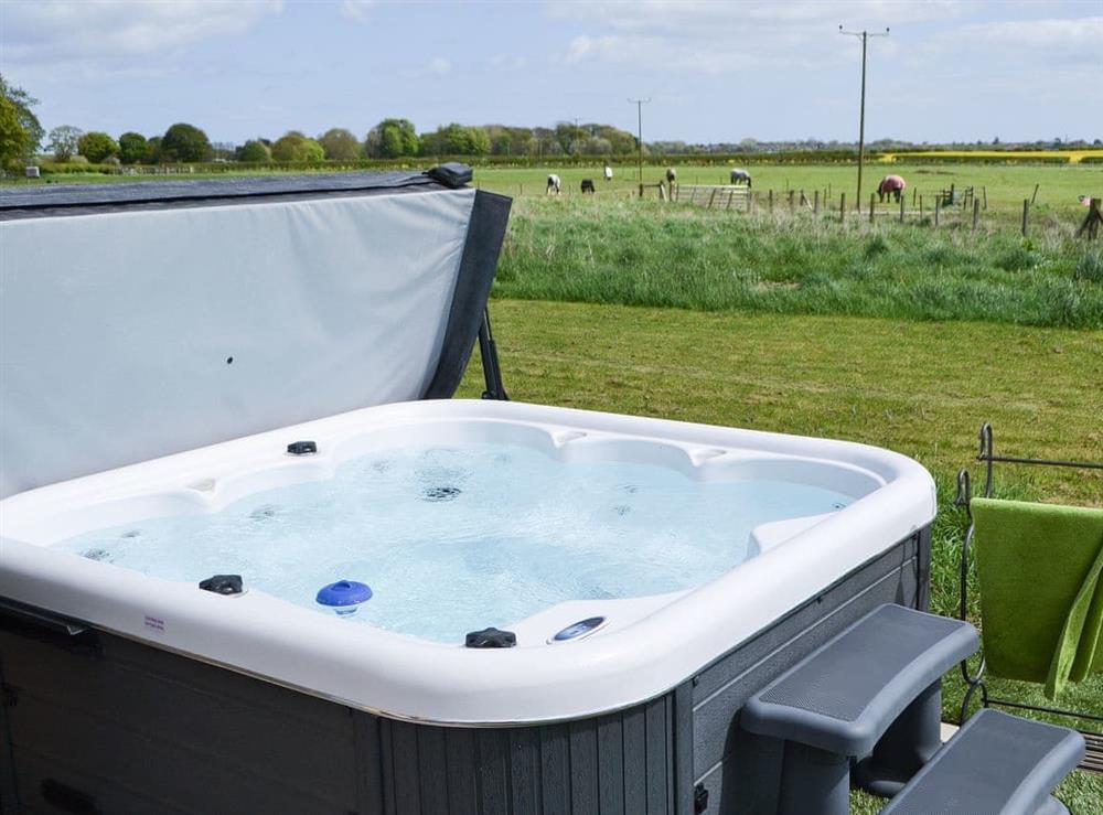 Hot tub with views of the surrounding countryside at Bothal Barns Drift in Bothal, near Morpeth, Northumberland