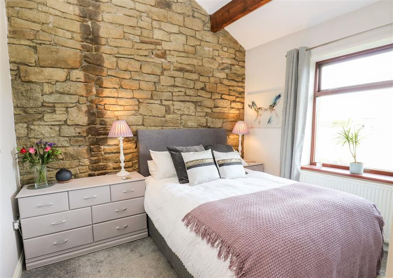 A bedroom in Boundary Cottage at Boundary Cottage, Golcar