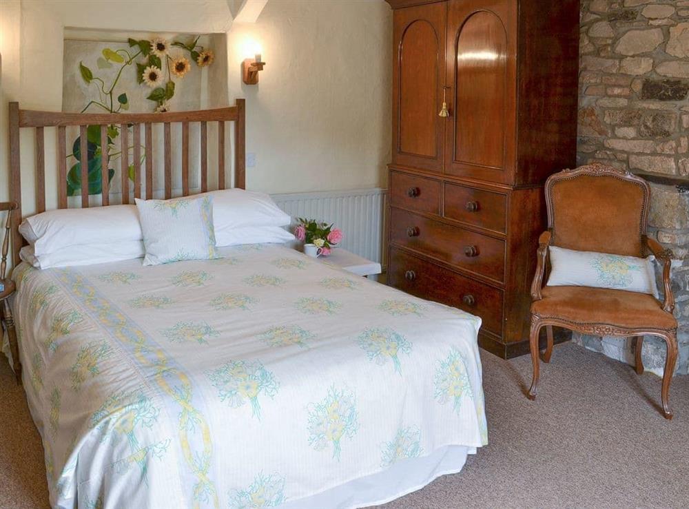 Master bedroom at Boundstone Farmhouse in Littleham, near Bideford, Devon