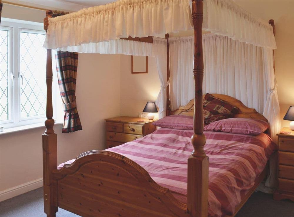 Four Poster bedroom at Bournstream Cottage in Bilbrook, near Minehead, Somerset