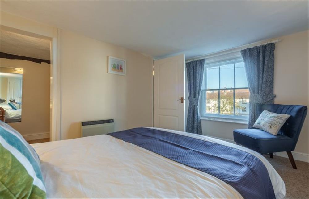 Main bedroom with views onto Barnaby Green at Bovis Cottage, Southwold