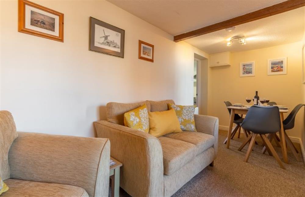 Open-plan sitting and dining area with seating for four at Bovis Cottage, Southwold
