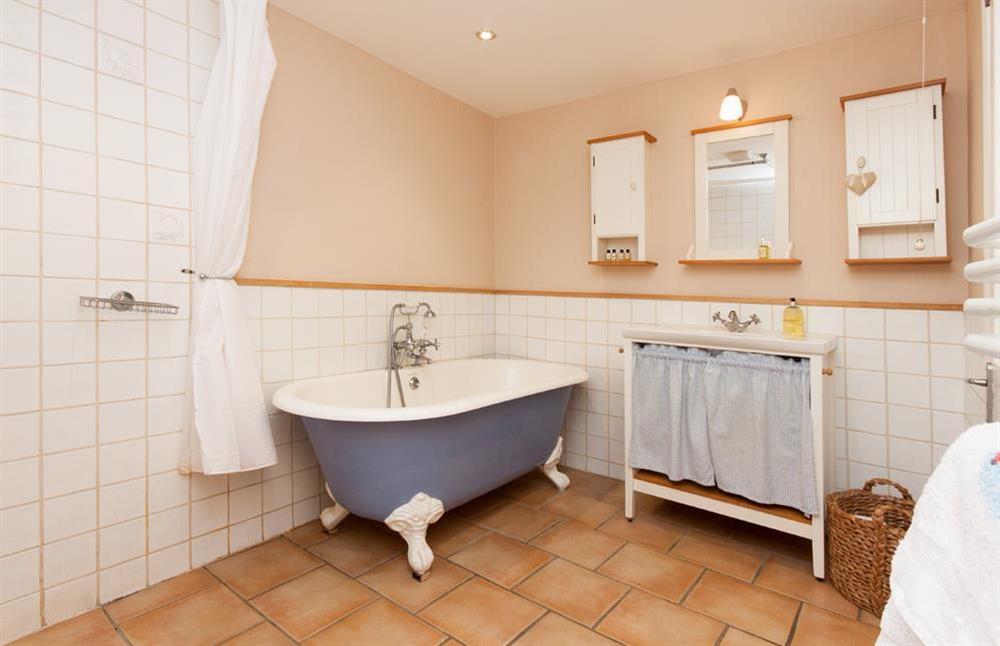 Bathroom with shower and roll-top bath at Bow Cottage in , East Portlem'th, Salcombe
