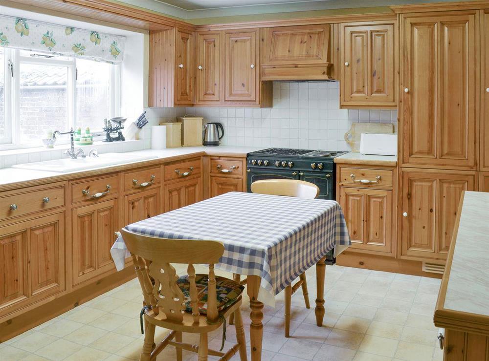 Large fitted kitchen with dining area at Bow Cottage in Pickering, North Yorkshire