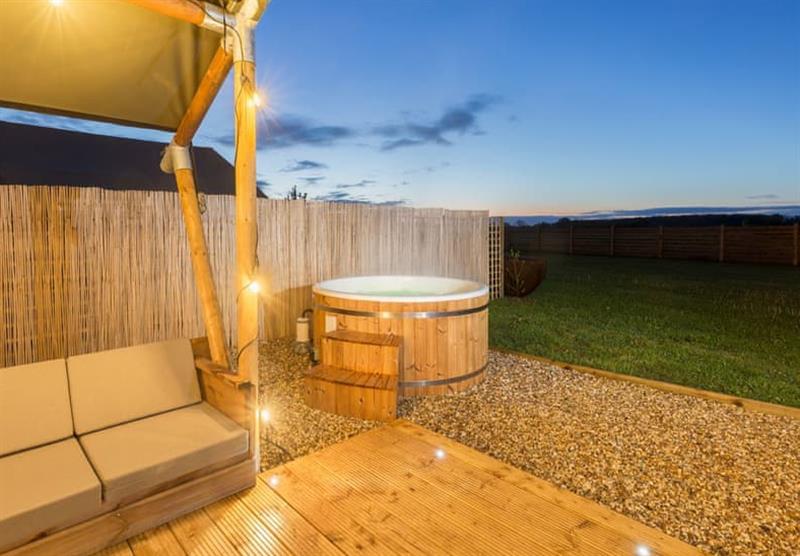 Relax in the hot tub with a holiday in Zebra Safari Tent at Bowbrook Lodges in Pershore, Worcestershire