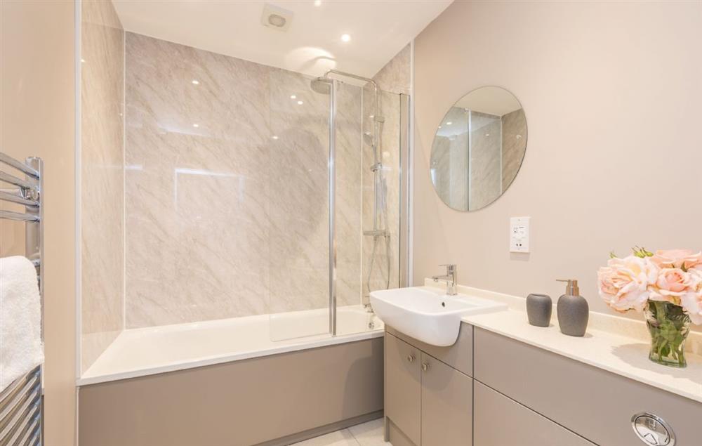 Family bathroom with bath and shower over at Bower Cottage, Hooke