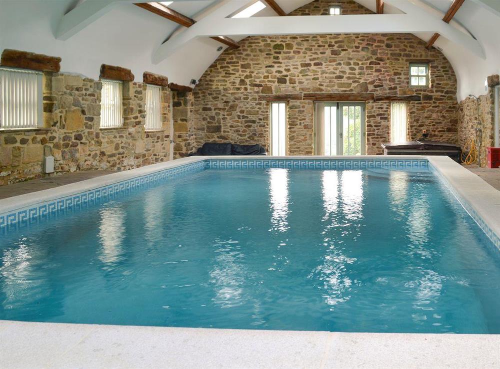 Inviting swimming pool and hot tub at Durham Cottage, 